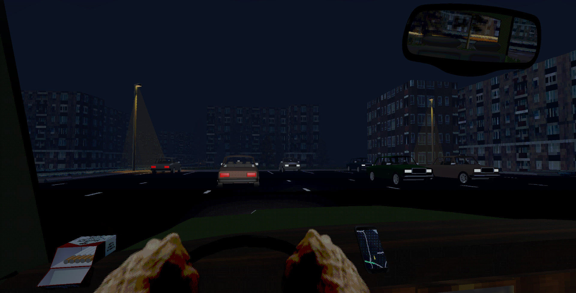Traffic ahead on a city road, with the GPS phone on the dashboard
